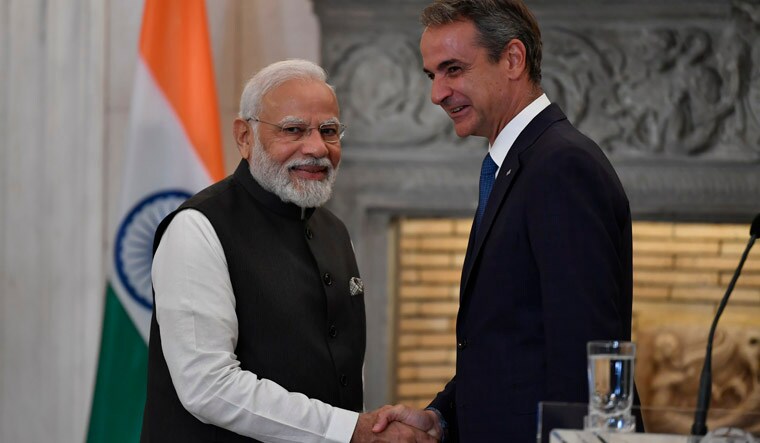 India's Prime Minister Narendra Modi, left, shakes hands with his Greek counterpart Kyriakos Mitsotakis after a meeting, at Maximos Mansion in Athens, Greece, Friday, Aug. 25, 2023. Modi's visit to Athens is especially significant for Greek foreign policy as it is the first official visit by an Indian prime minister to Greece in 40 years.