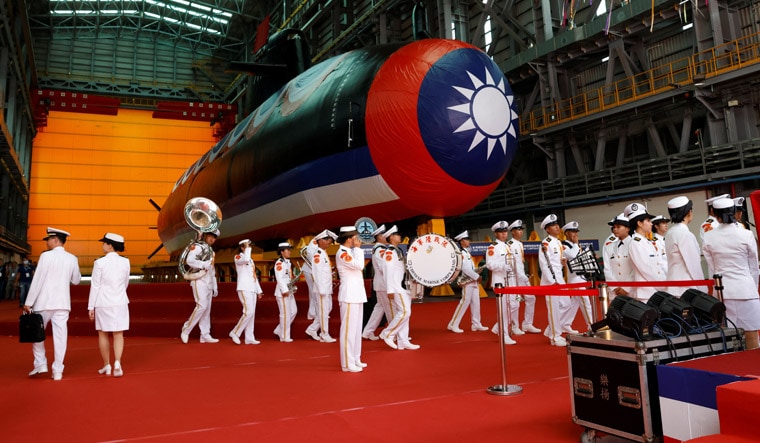 Members of the navy band walk past Haikun, Taiwan's first domestically built submarine, after its launching ceremony in Kaohsiung, Taiwan September 28, 2023. REUTERS/Carlos Garcia Rawlins