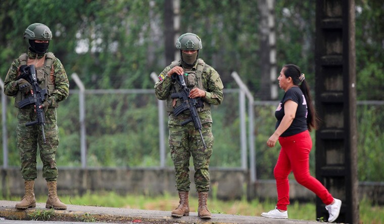 Soldiers keep watch outside the Zonal 8 prison after Ecuador's President Daniel Noboa declared a 60-day state of emergency