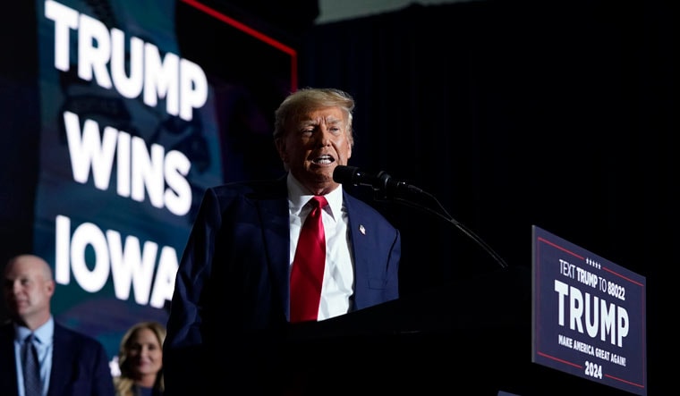Republican presidential candidate and former President Donald Trump speaks at a caucus night party in Des Moines | AP