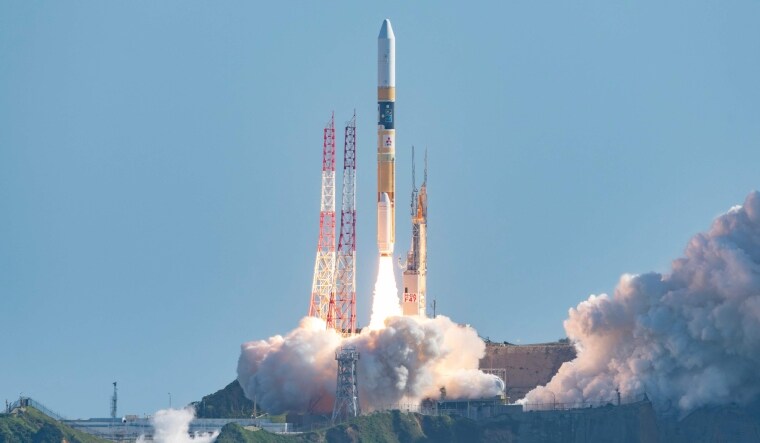 Japan's H-IIA rocket carrying a small lunar surface probe and other objects lifting off. | AFP