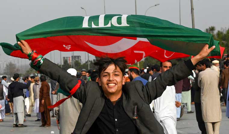  Supporters of PTI block Peshawar to Islambad highway as they protest against the alleged skewing in Pakistan's national election results, in Peshawar | PTI