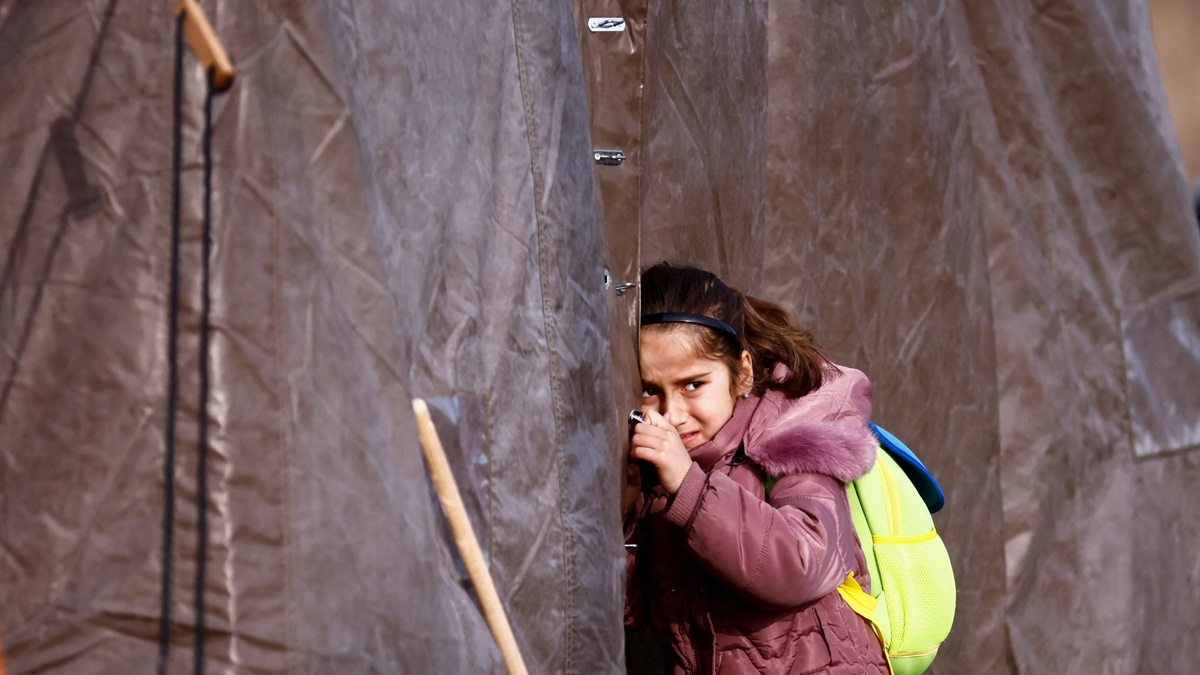 A child fleeing Ukraine at a temporary camp in Przemsyl, Poland | Reuters