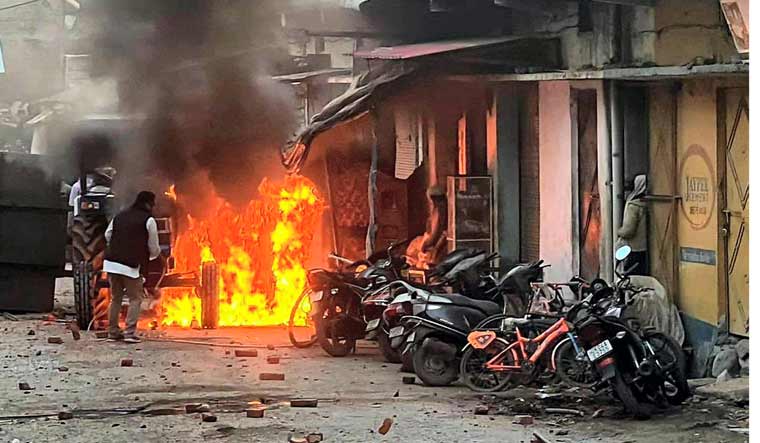Vehicles set on fire by miscreants over the demolition of an "illegally built" madrasa at Banbhoolpura area, in Haldwani, Uttarakhand | PTI