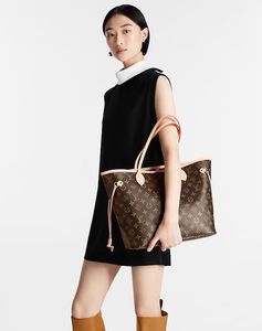 A woman holding Louis Vuitton Neverfull bag | Courtsey Louis Vuitton