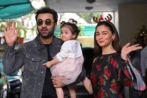 Actors Ranbir Kapoor and Alia Bhatt with their daughter Raha | AFP