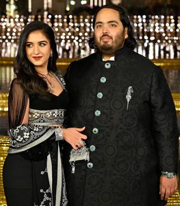 Radhika Merchant, seen with fiancé Anant Ambani, carries a Hermès Kellymorphose | Getty Images