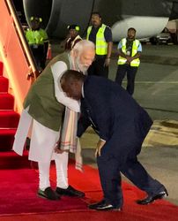 PM of Papua New Guinea James marape touching PM Modi's feet upon his arrival there | PTI