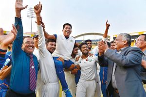 On a roll: Vidarbha players lift Pandit after winning the Ranji trophy final | PTI