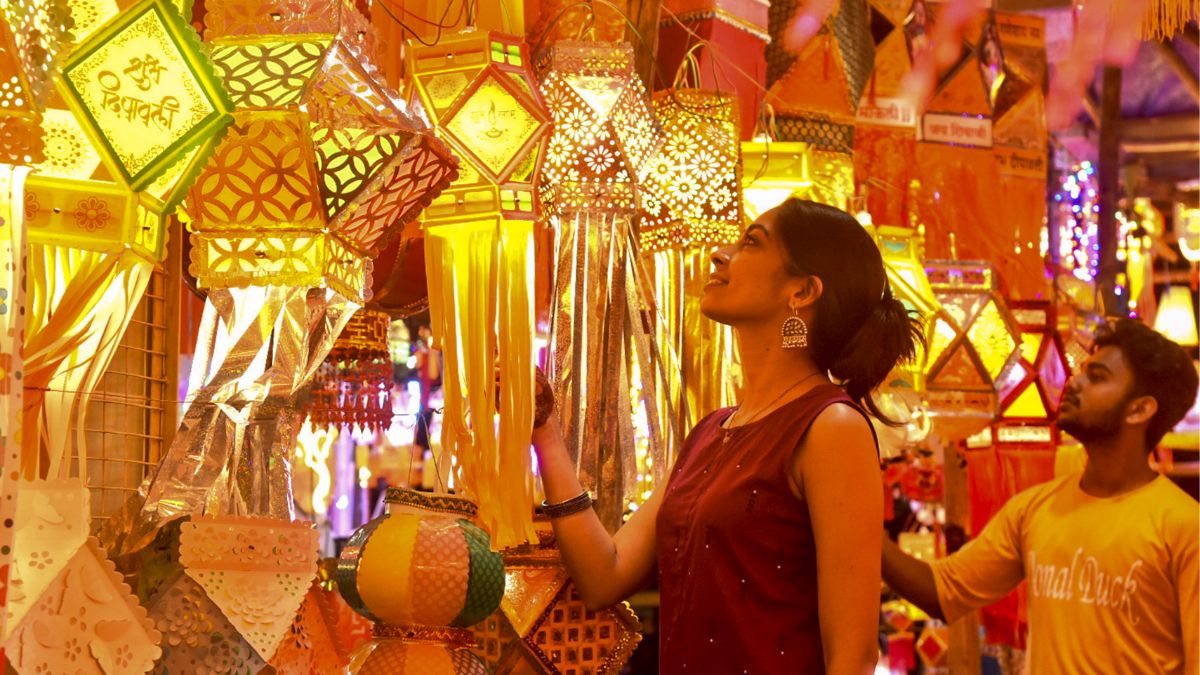 Youngsters shop for Diwali lights in a market at Nagpur, Maharashtra | PTI
