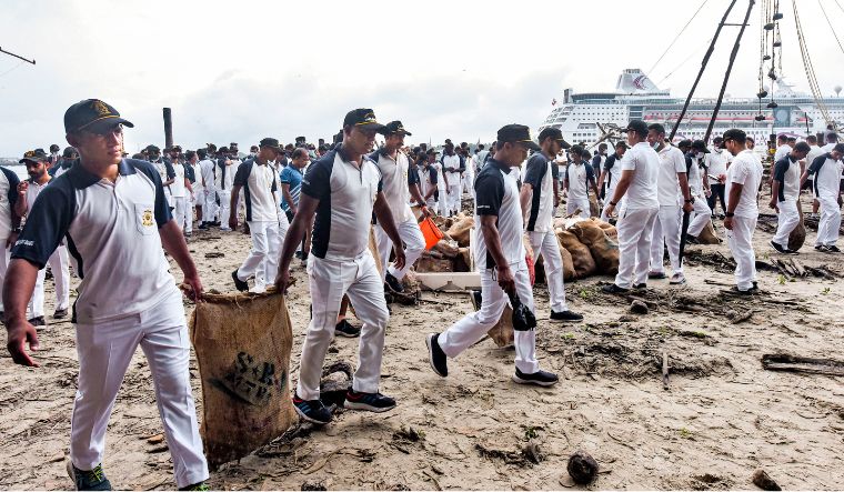 A team of the Indian Coast Guard collect garbage during a cleanliness drive to mark World Environment Day, at the beach, in Kochi, Wednesday, June 5, 2024 | PTI