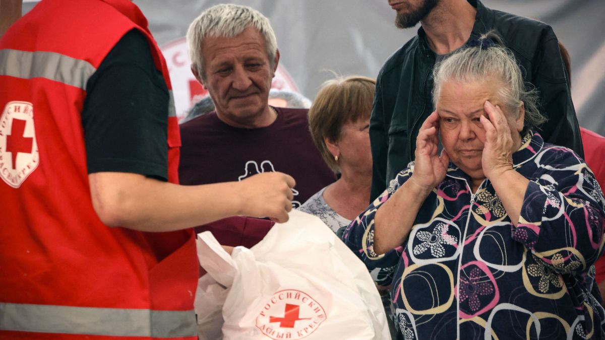War-displaced people receive humanitarian aid at a Russian Red Cross distribution point in Kursk on August 15, 2024, following Ukraine's offensive into Russia's western Kursk region | AFP