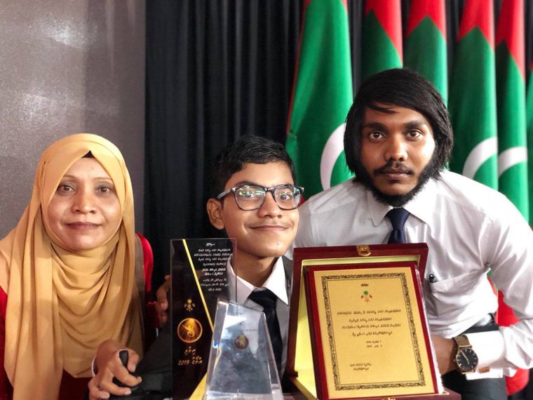Mark of honour: Raishan with his mother, Aminat, and brother Rishwan Shiyam after receiving the Riveli Award, given by the Maldivian government that celebrates individuals and organisations that support people with disabilities, in 2019.