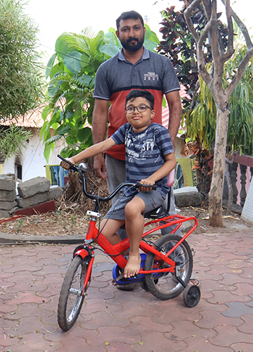 Riding on hope: Jins Antony with son Jion, who suffers from Duchenne muscular dystrophy | Nirmal Jovial