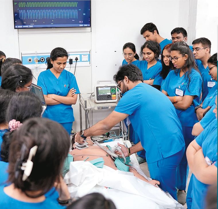 Life-saving lessons: Doctors practise resuscitation on a manikin.