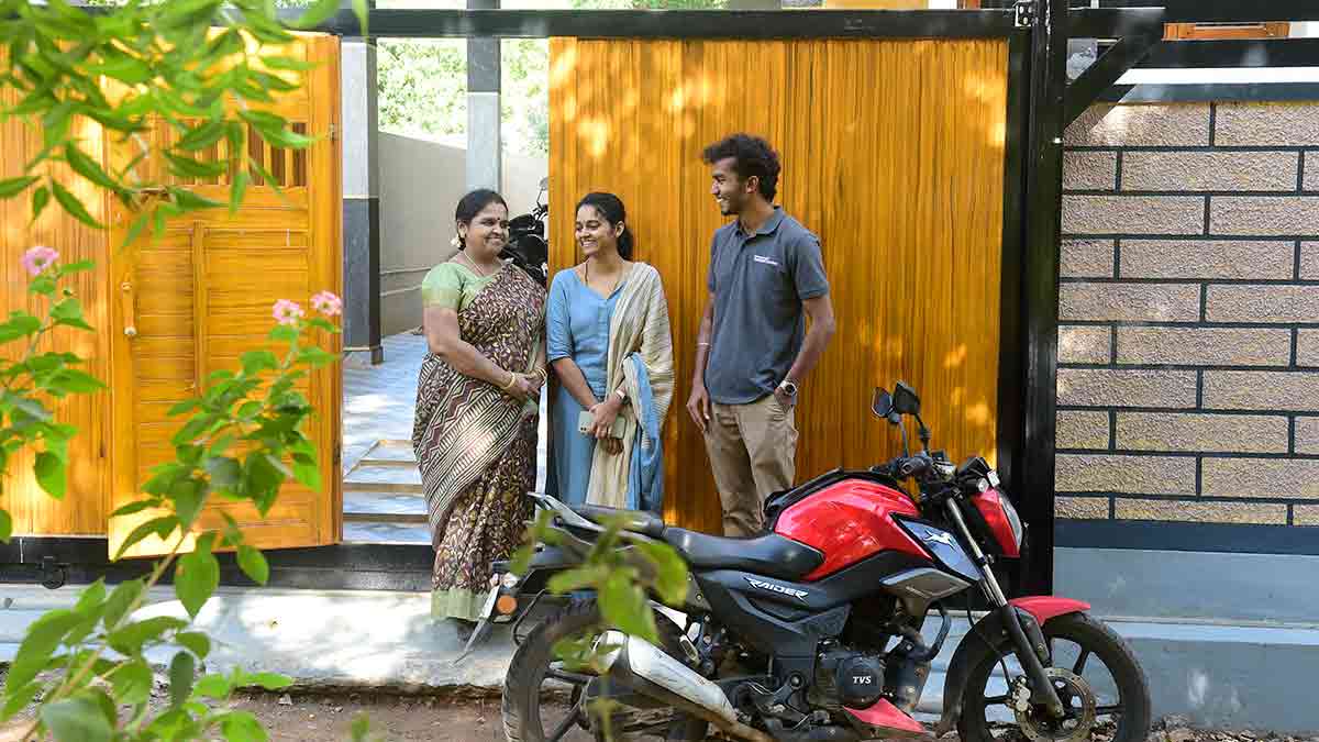 Coding for life: Ananthan Arunachalam of Kadayam Perumbathur with his mother Sumathi (left) and wife Akila in front of their house in Tenkasi | Sanjoy Ghosh