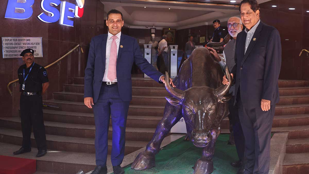 Taming the bull: Hitesh Sethia, president and CEO of Jio Financial Services, Subhash S. Mundra, chairman of BSE, and K.V. Kamath, independent director and non-executive chairman of Jio Financial Services, after the listing ceremony of Jio Financial Services in August 2023 | Reuters