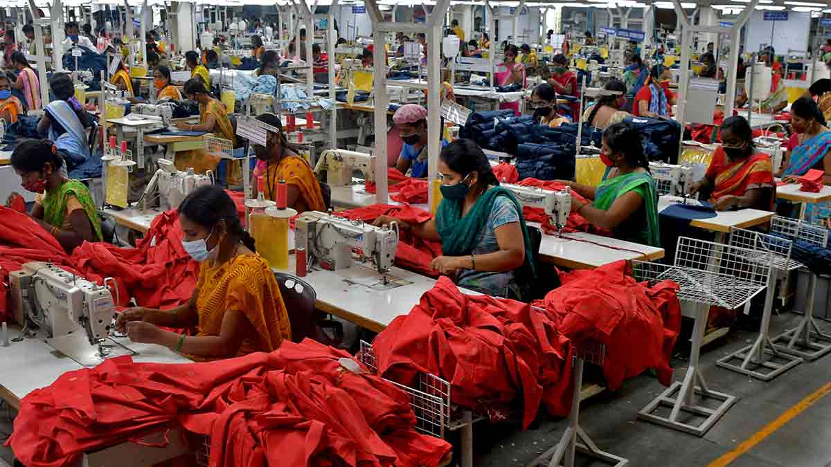A stitch in time: Garment workers stitch shirts at a textile factory in Hindupur town in Andhra Pradesh. The garment sector will be hit hard if the tariffs come into force | Reuters