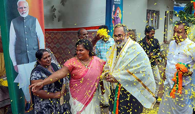 Rooting for victory: Union Minister and BJP candidate Rajeev Chandrasekhar campaigning at Pulluvila in Thiruvananthapuram on April 12 | PTI