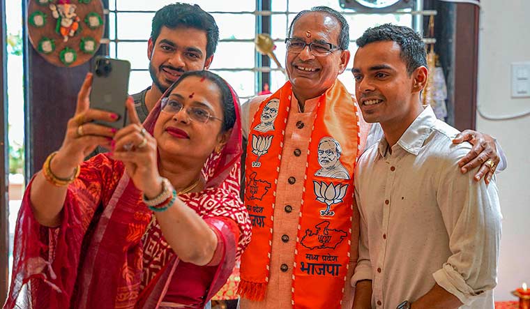 Still running: Shivraj Singh Chouhan with wife, Sadhna Singh, and sons Kartikeya Singh Chouhan and Kunal Singh Chouhan.
