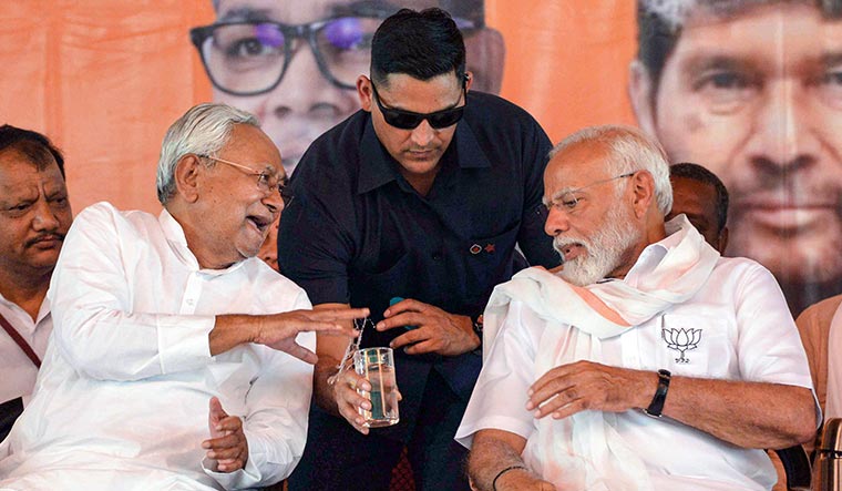 Glass half full: Prime Minister Narendra Modi with Bihar Chief Minister Nitish Kumar during a public meeting  in Jamui, Bihar | PTI