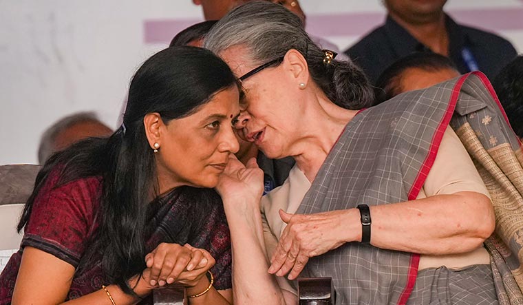 United front: Sunita Kejriwal with Sonia Gandhi during the INDIA bloc’s rally in Delhi on March 31 | PTI