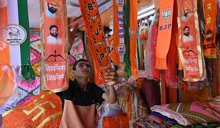 16-A-shopkeeper-arranges-scarves-bearing-symbols