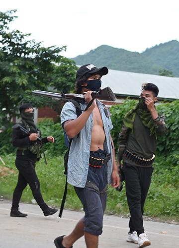 Up in arms: Armed Kuki youth guarding their village in Churachandpur district.