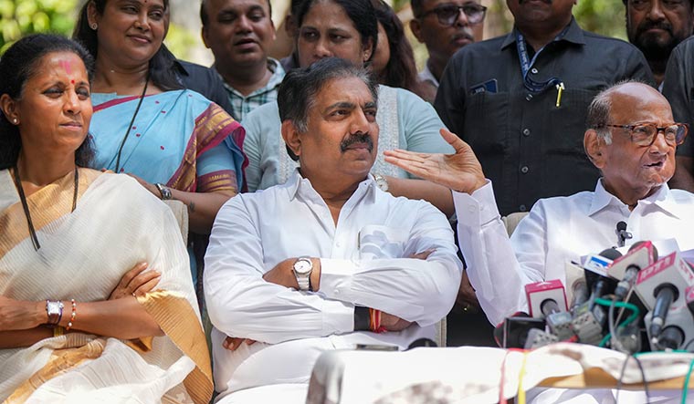Winning hand: Sharad Pawar with Supriya Sule (left) and   NCP(SP) leader Jayant Patil (centre) | PTI