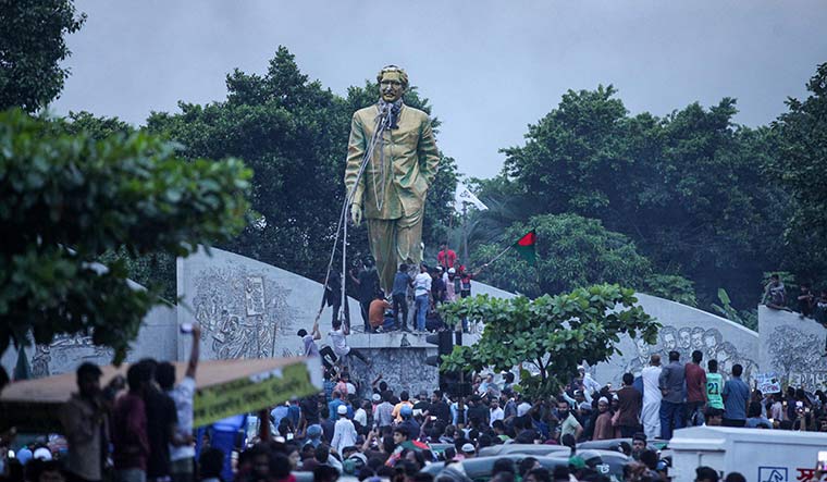 Mob justice: Protesters vandalise a statue of Sheikh Mujibur Rahman in Dhaka | AFP