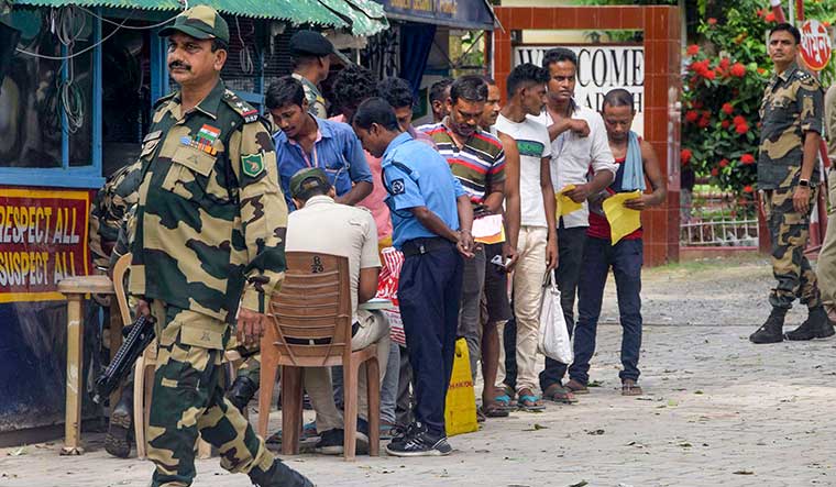 All lined up: Truck drivers finish formalities to return to India from Bangladesh at the border checkpost at Hili in West Bengal | PTI