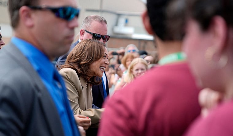 Service with a smile: Kamala Harris greets supporters as she arrives in Westfield in Massachusetts | AP