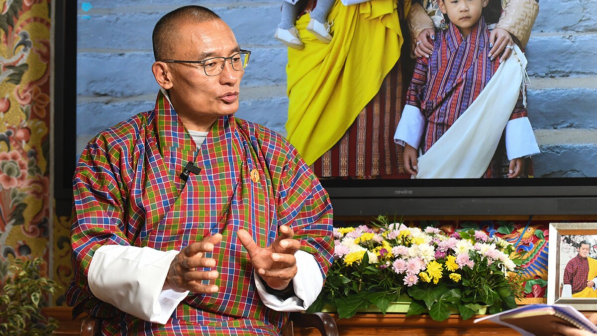 Taking the lead: Prime Minister Tshering Tobgay at his office. In the background is the photo of the royal family | Sanjay Ahlawat