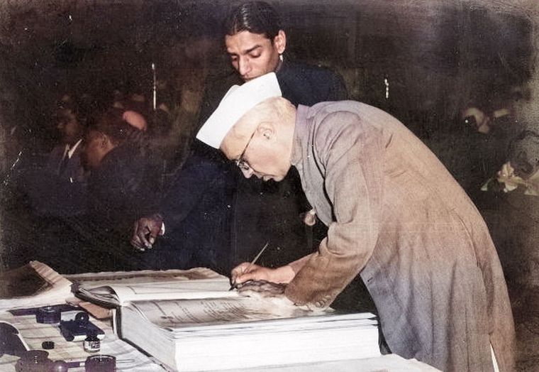 Signed and sealed: Nehru signs the Constitution.