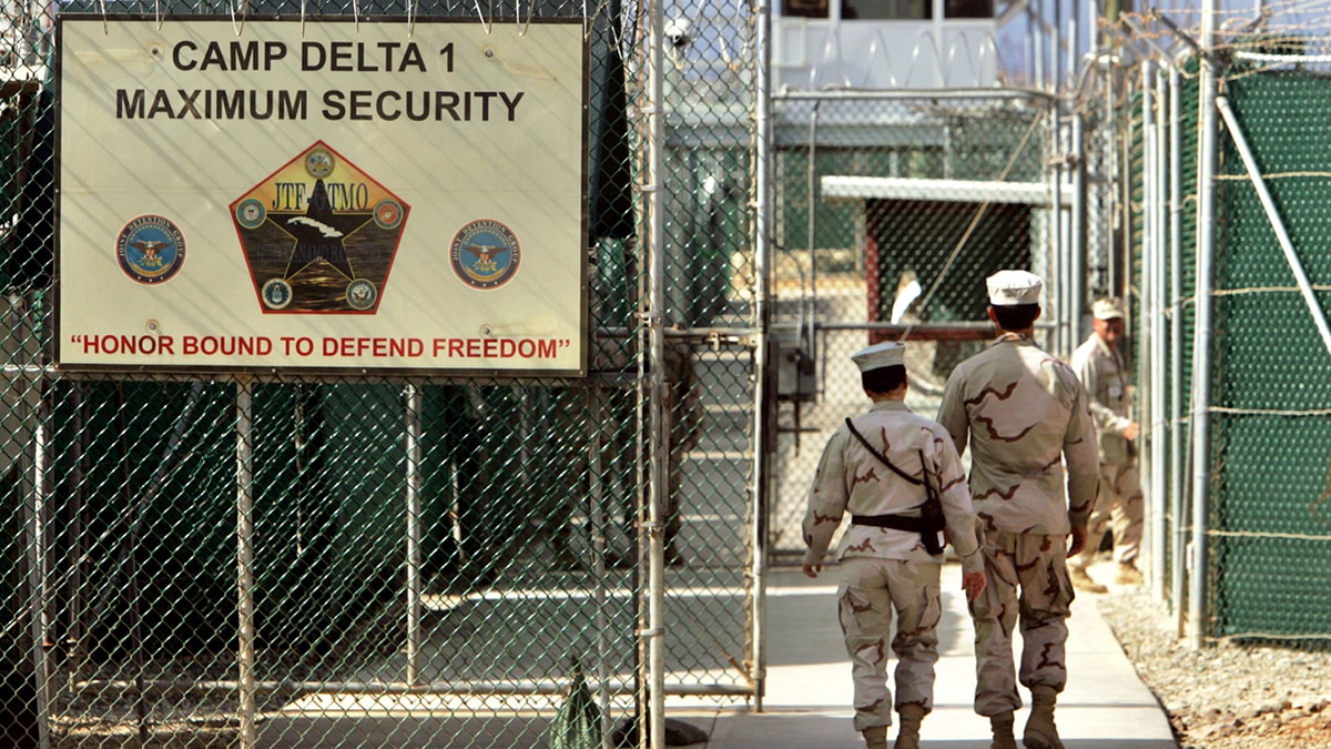 US military guards walk within Camp Delta military-run prison, at the Guantanamo Bay US Naval Base | AP
