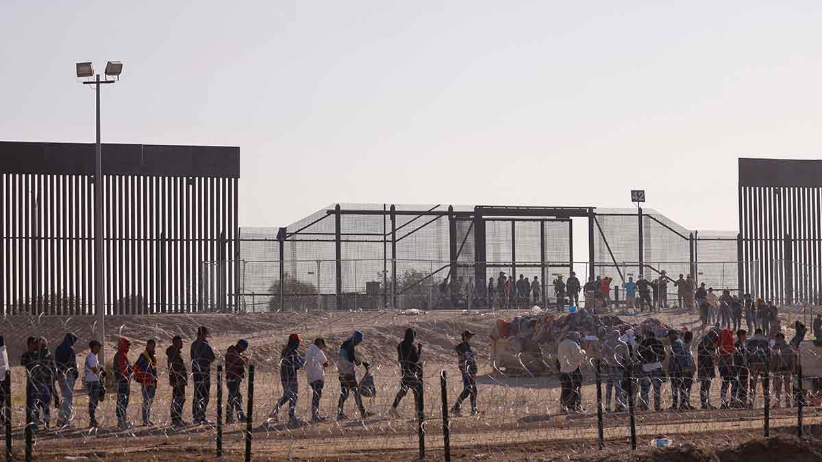 Agonising wait: migrants queue up to surrender before border patrol agents after having crossed into the us from mexico | Reuters