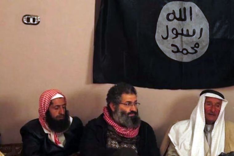 Last stand: A 2014 photograph of Mohammed Haydar Zammar (centre) at a meeting between Islamic State militants and Syrian tribesmen.