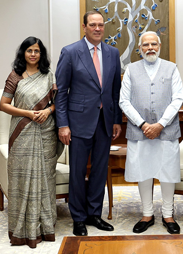 In eminent company: Daisy Chittilapilly with Cisco CEO Chuck Robbins and PM Narendra Modi.
