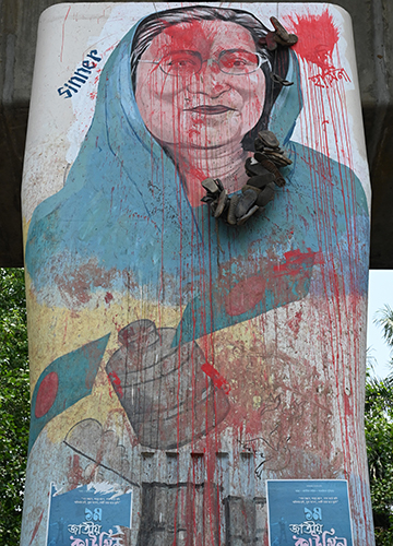 Out with the old: A portrait of Sheikh Hasina defaced in Dhaka | Salil Bera