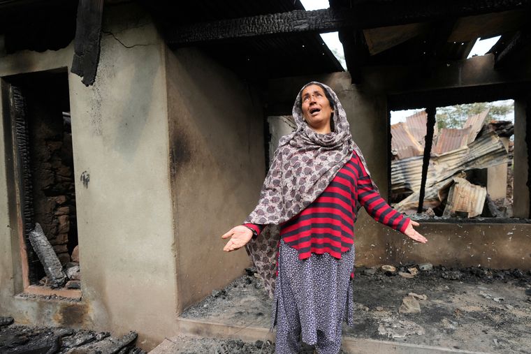 Future tense: Rubina Begum wails as she stands outside her house damaged by Pakistani shelling, at Salamabad, north of Srinagar | AP