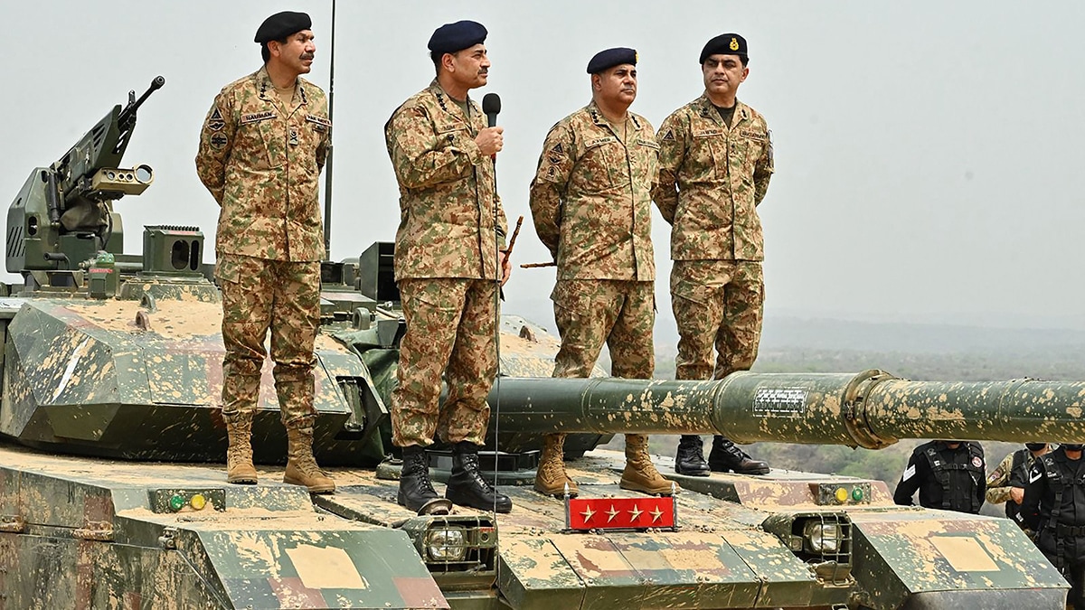 In the firing line: General Asim Munir (with the mic) at a field training exercise in Jhelum, Punjab province | AFP