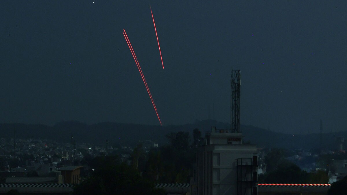 Sentinels of the skies: Trails from an Indian air defence system are seen above Jammu on May 9 | AFP