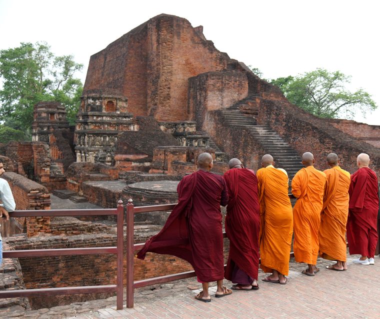 Remnants of the past: Monks near the site of the Nalanda Mahavihara ruins.