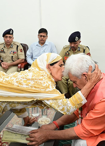 Hope floats: A family member of a terror victim greets Lieutenant Governor Manoj Sinha | PTI