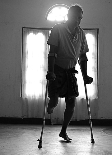 Gajaba Regiment soldiers M.G. Dayananda and (below) Ekanayake Bandara who now live in a ranaveerugama settlement built by the government to house injured veterans.