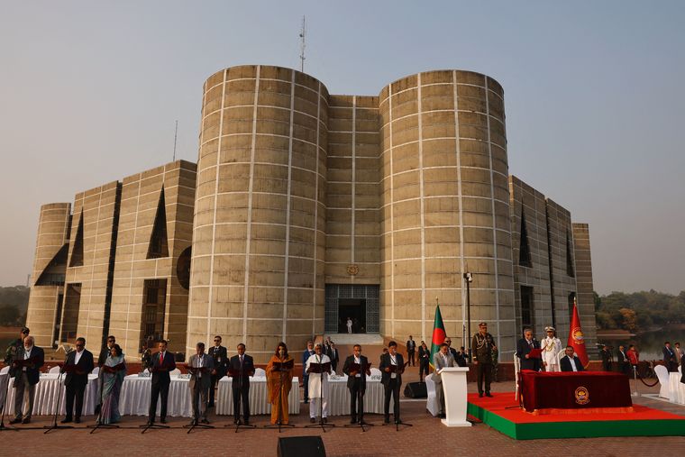 Fresh start: Bangladesh President Mohammed Shahabuddin administers oath of office to new cabinet members at the South Plaza of the parliament building in Dhaka | Reuters