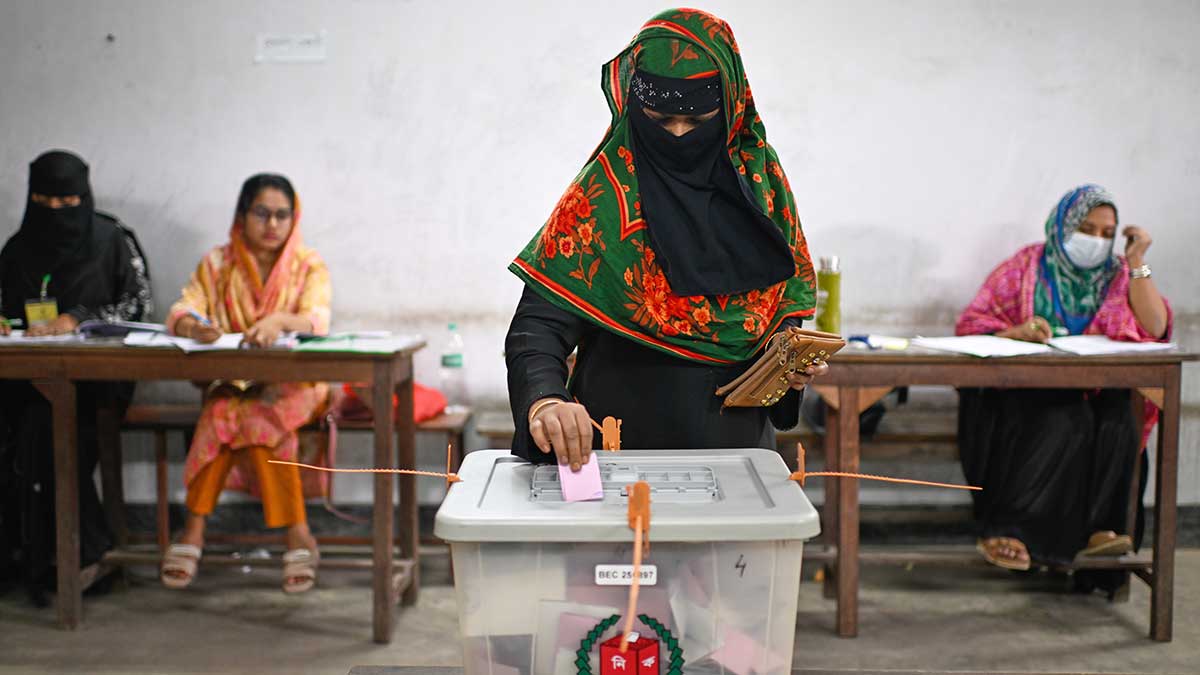 Proving a point: A woman casts her vote at a polling station in Dhaka | AP