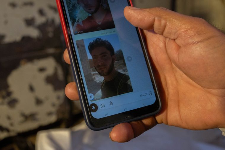Fading hope: Mohammed Shaab, an ex-army man, shows photos of his missing brother who was thought to be in Saidnaya prison | Anagha Subhash Nair