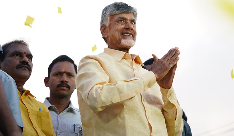 Rebound strategy: Chandrababu Naidu greets supporters during a campaign event.