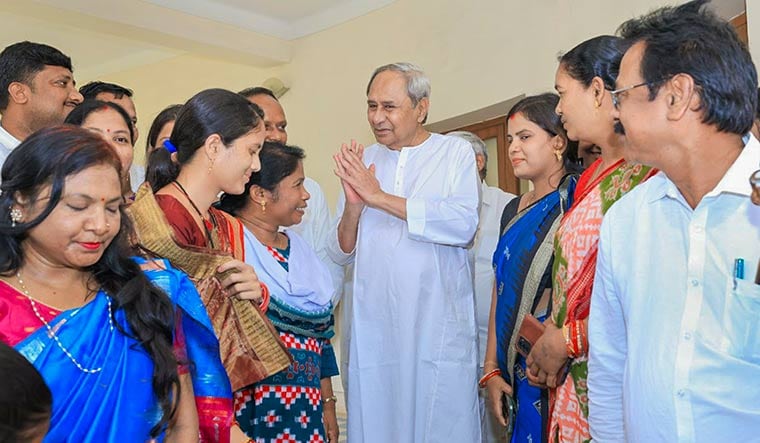 Change of tack: Naveen Patnaik with party workers in Bhubaneswar | PTI